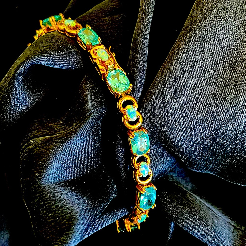8 inch gold plated opal and Pluto has bracelet